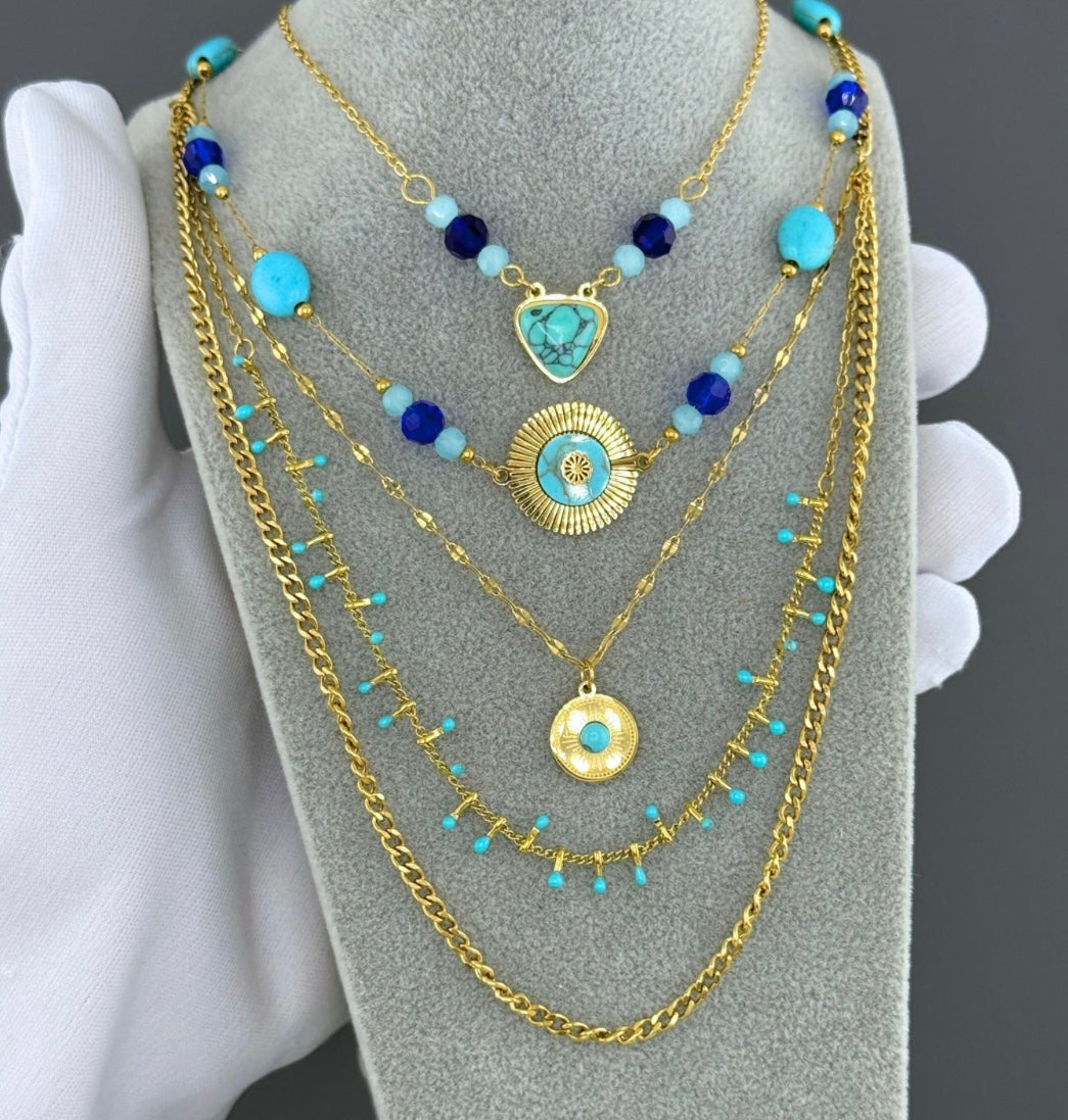 Evil eye necklace with cubic zirconia and blue stone charms attached. Perfect for summer wear. 40/48+6 cm. Code 90705