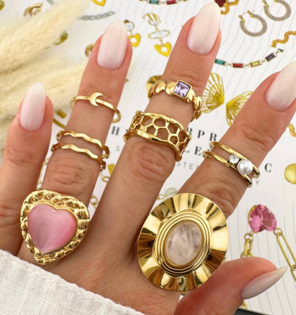 Elegant & stylish flower ring with large pearl inset Adjustable fit. Code 90173