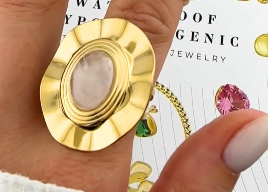 Elegant & stylish flower ring with large pearl inset Adjustable fit. Code 90173