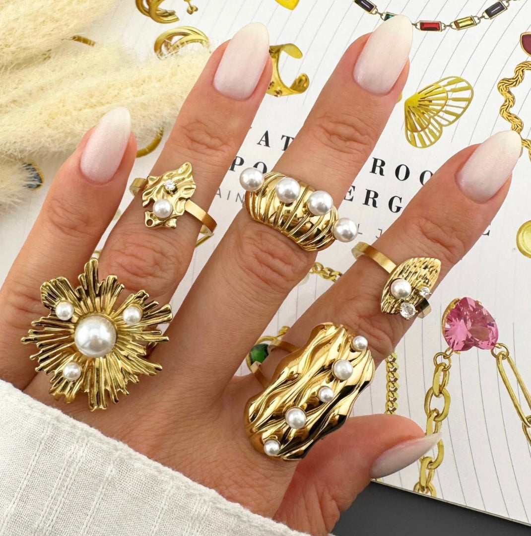 Amazing flower and imitation pearls party ring, stand out in the crowd. Adjustable fit. Code 90211