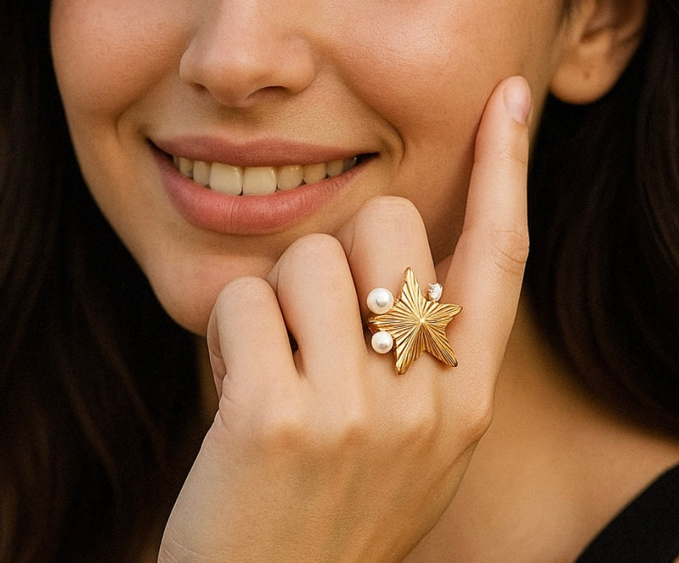 Beautiful star ring inlaid with cubic zirconia & imitation Pearls. Adjustable fit. Code 90131