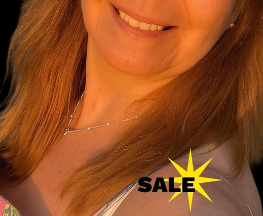 Stylish & elegant silver chain with intertwined ball effect. 20 inch length