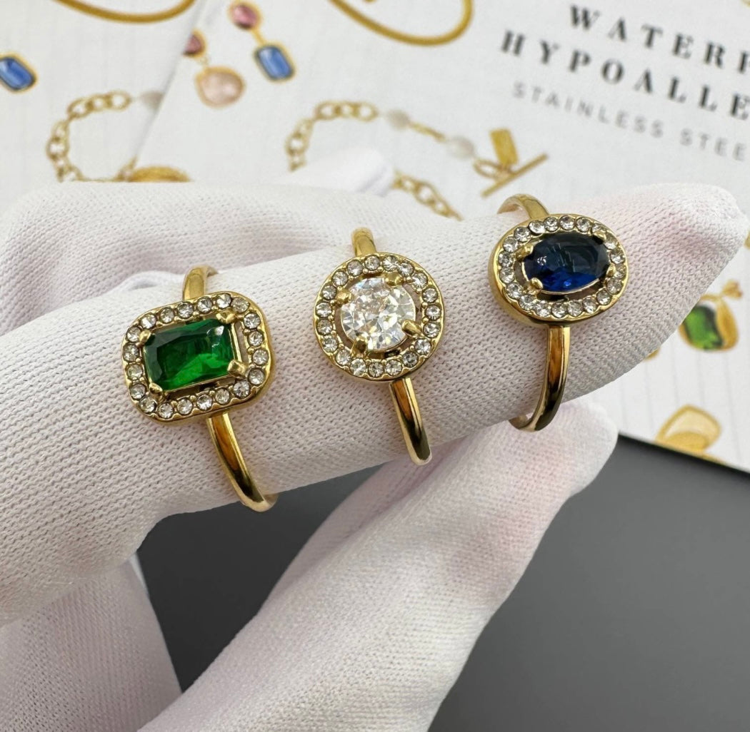 Elegant imitation emerald green ring inlaid with cubic zirconia stones. Adjustable fit. Code 89186