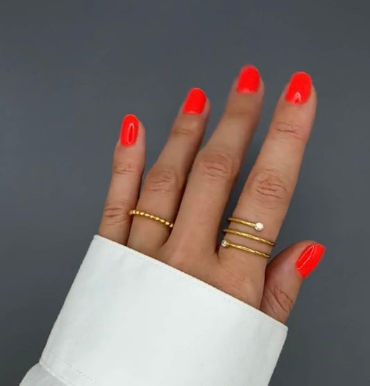 Beautiful gold plated ring with cubic zirconia stones. Adjustable fit. Code 87447