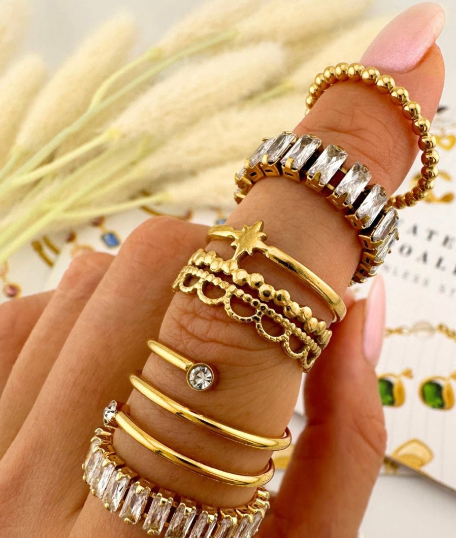 Beautiful gold plated ring with cubic zirconia stones. Adjustable fit. Code 87447