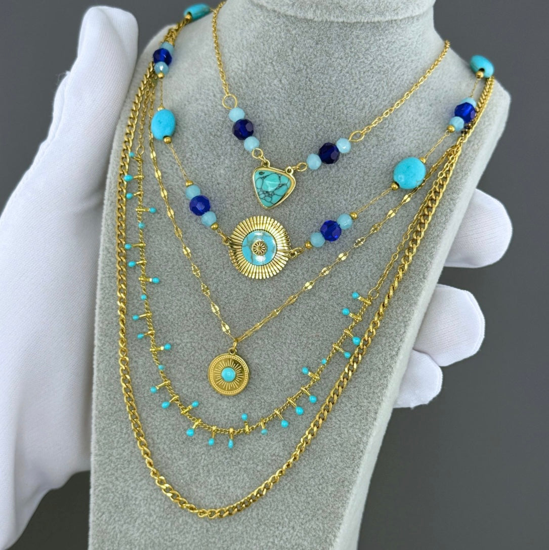 Evil eye necklace with cubic zirconia and blue stone charms attached. Perfect for summer wear. 40/48+6 cm. Code 90705