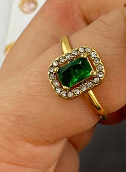 Elegant imitation emerald green ring inlaid with cubic zirconia stones. Adjustable fit. Code 89186