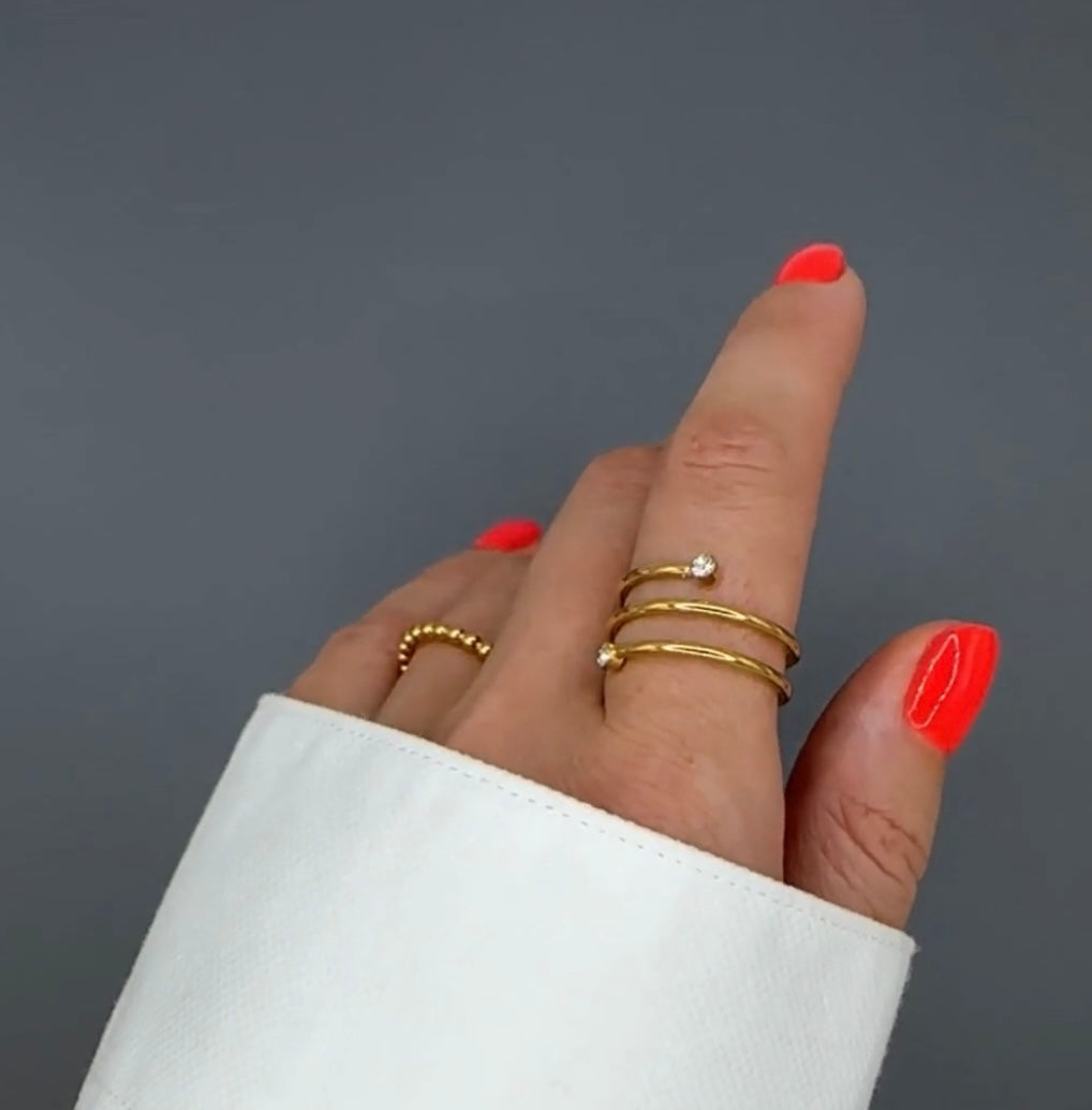 Beautiful gold plated ring with cubic zirconia stones. Adjustable fit. Code 87447