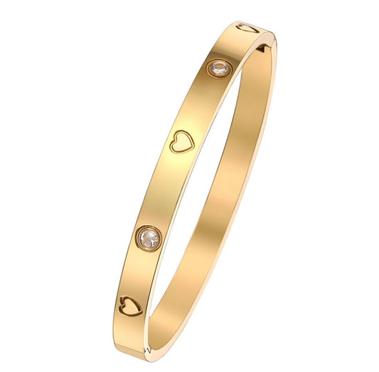 18K gold plated bracelet with heart engraving and cubic zirconia. 6.5cm. Code 89900