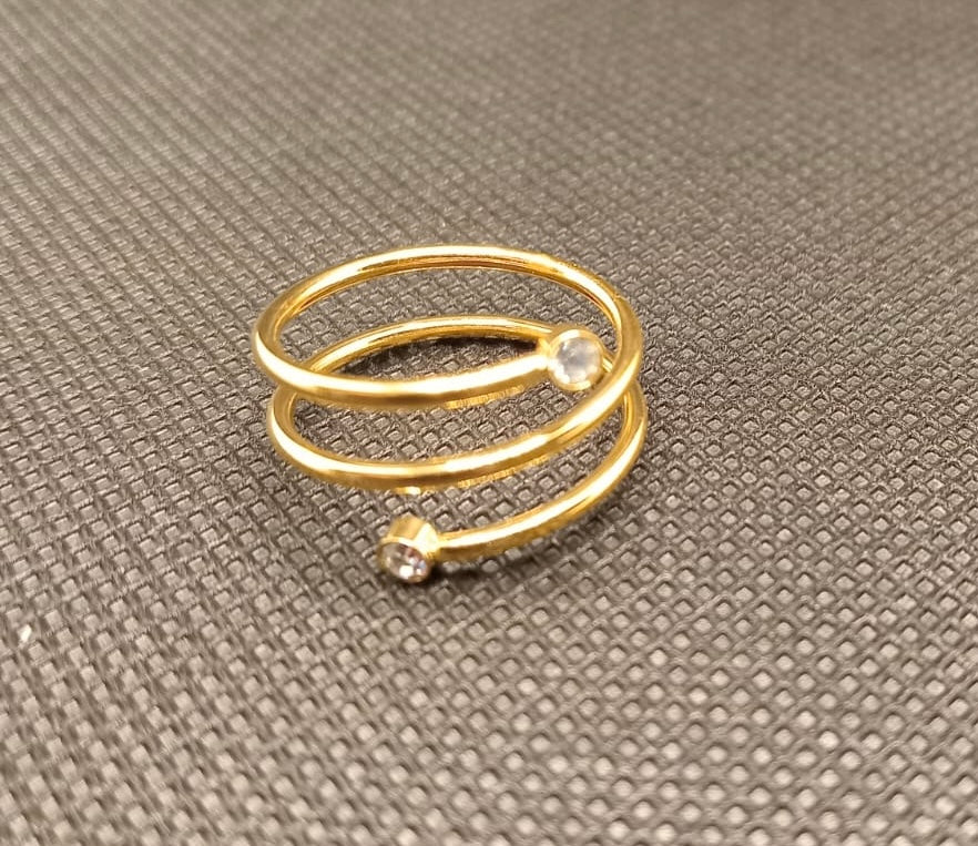 Beautiful gold plated ring with cubic zirconia stones. Adjustable fit. Code 87447