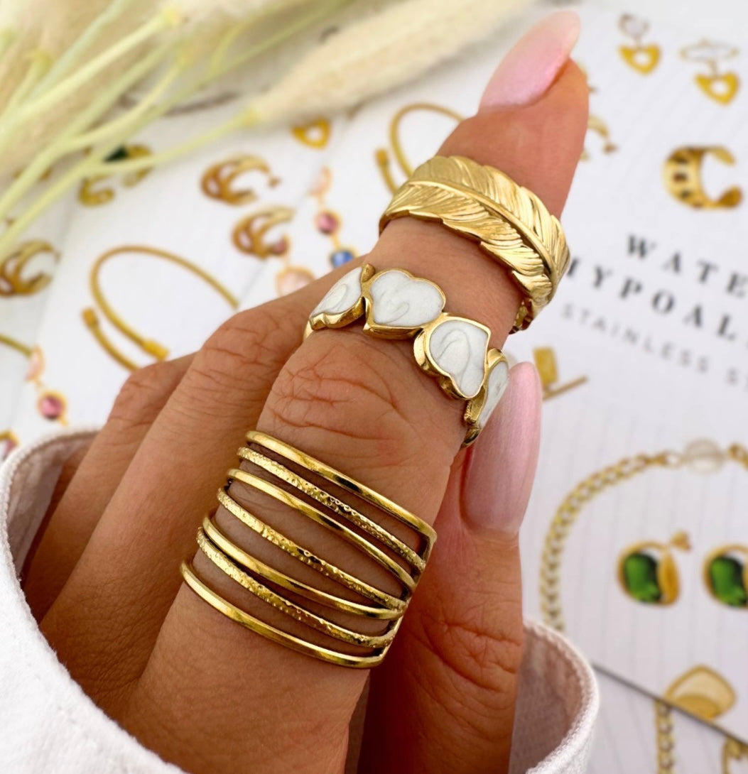 Beautiful & stylish heart ring with ceramic white heart inlays.Matching necklace and earrings also available. Code 87119